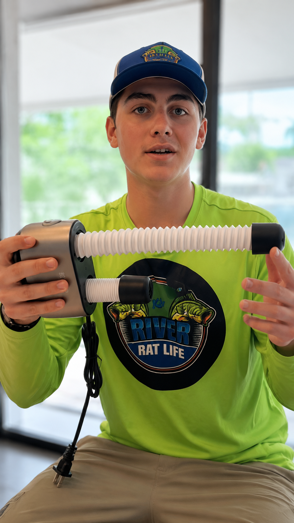 Creator demonstrating the SOTHING boot dryer hose